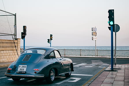 classic black car parked on road at daytime thumbnail