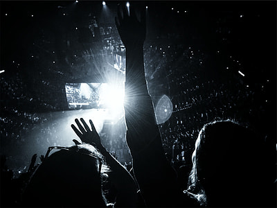 grayscale photo of people raising hands thumbnail