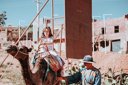 girl raining on camel thumbnail