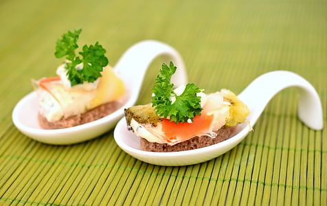 appetizer with leafy green on white ceramic spoon thumbnail