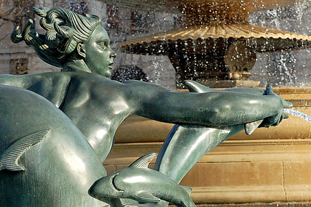 statue of person and dolphin thumbnail