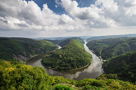 photograph of river between trees thumbnail