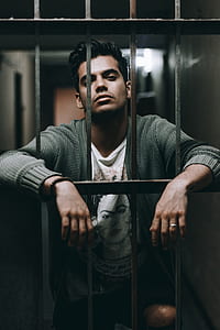 man behind bars thumbnail