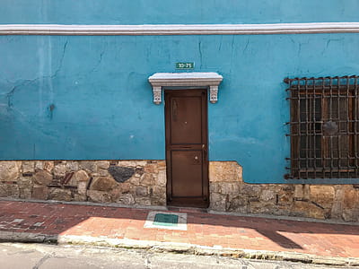 Brown Wooden Shut Door Beside Empty Sidewalk thumbnail
