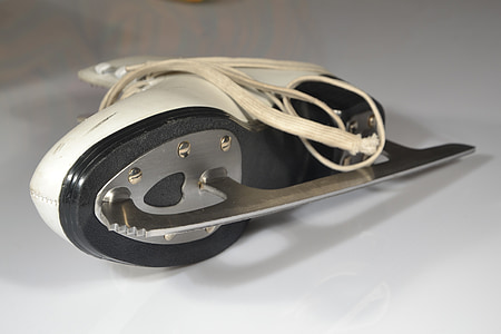 unpaired white skate shoe on white surface thumbnail