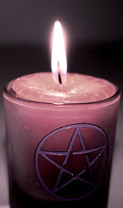 closeup photo of lighted pink votive candle thumbnail