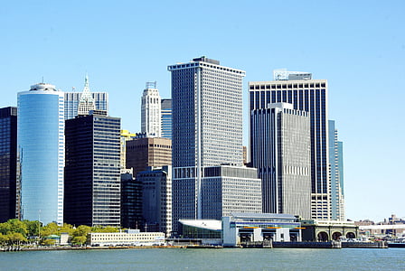 high-rise buildings near body of water thumbnail