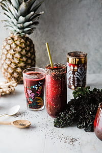clear drinking glass near white plastic spoon over pineapple fruit thumbnail