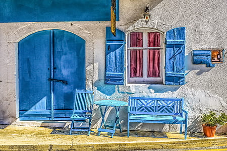 blue wooden bench below of white windowpane thumbnail