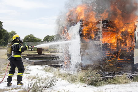 fireman wearing black firesuit thumbnail