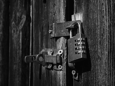 grayscale photo of gate padlocked thumbnail