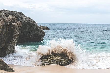 sea waves splashed on rock formation thumbnail