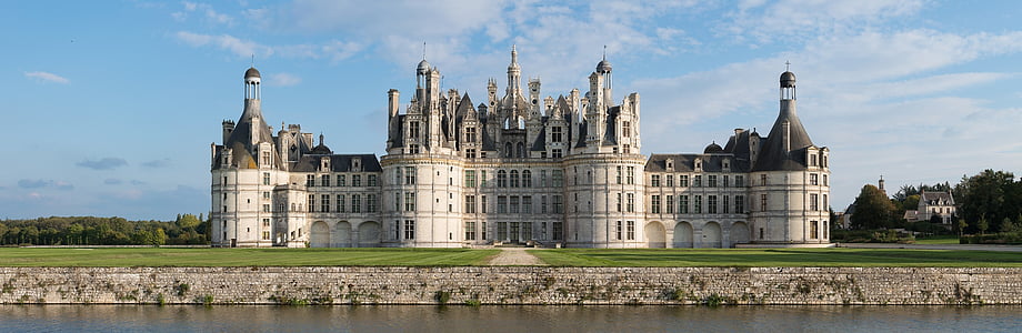 white and black castle near body of water thumbnail