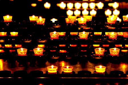 lighted candles during nighttime thumbnail