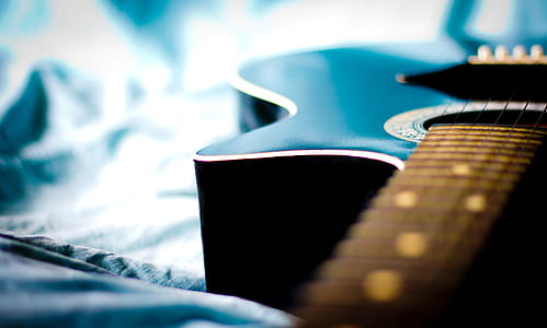photography of black guitar thumbnail