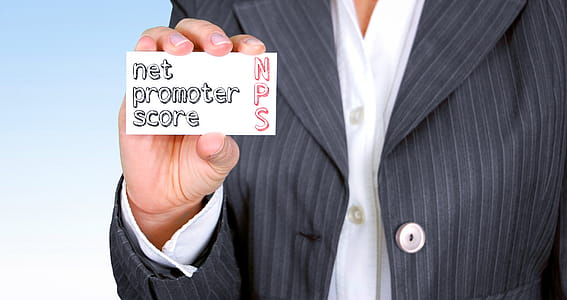 Business person holding card with net promoter score. thumbnail