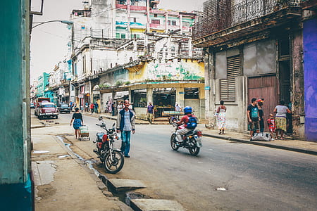people walking and standing on the road atdaytime thumbnail