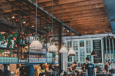 people eatting inside of cafe with pendant lamps thumbnail