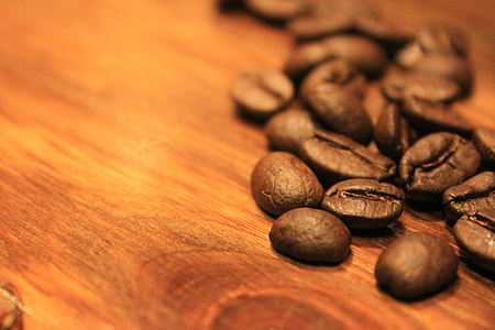 coffee beans on brown wooden board thumbnail