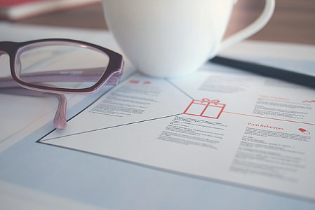 white coffee mug on top of magazine page thumbnail