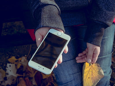 person holding post-2014 iPhone thumbnail
