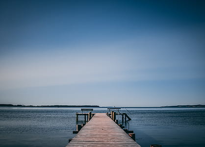 brown wooden dock surrounded by body of water thumbnail