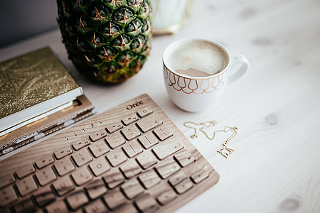 Wooden keyboard and cup of coffee thumbnail