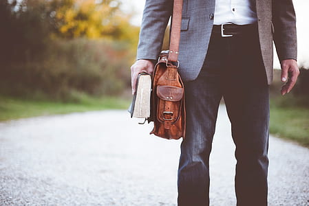 person in gray formal jacket and black pants thumbnail
