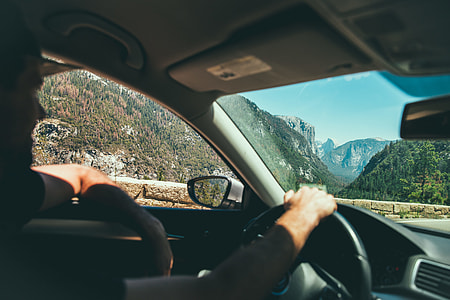 man wearing black shirt driving car thumbnail
