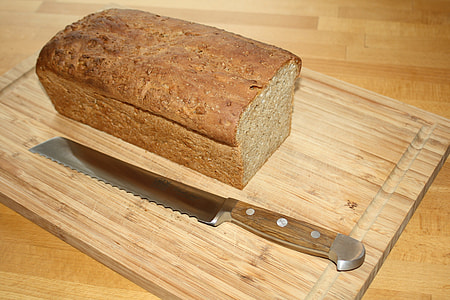 loaf of bread on chopping board thumbnail