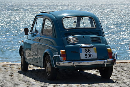 blue 3-door hatchback parked thumbnail