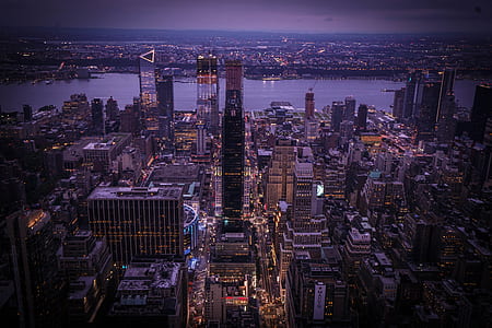 photo of high-rise buildings near body of water thumbnail