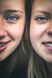 closeup photo of two women's faces thumbnail