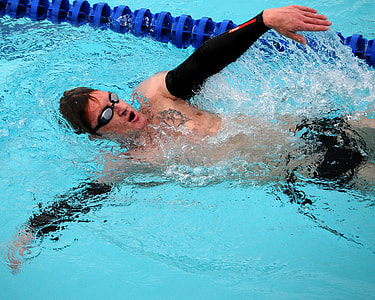 man swimming in Olympic pool thumbnail