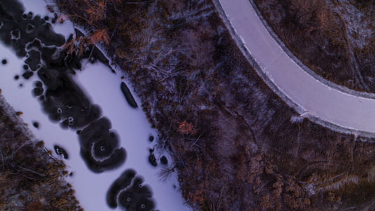 bird's eye view photo of roadway on top of mountain thumbnail