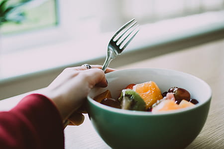 Person Holding Fork and Bowl of Fruits thumbnail