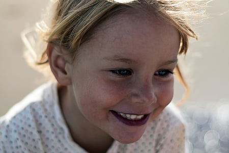 focus photography of girl wearing white top thumbnail