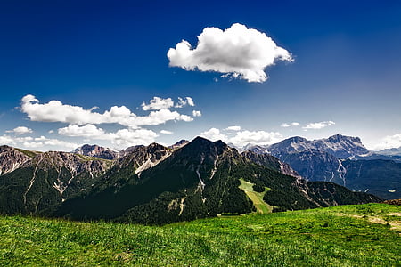 green mountains under gray clouds thumbnail