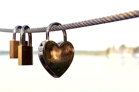 three padlocks locked on rope thumbnail