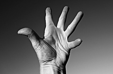 grayscale photography of left human hand thumbnail