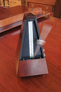 brown and gray metronome on brown surface thumbnail
