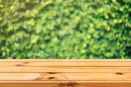 brown wooden surface near green leaf plant thumbnail
