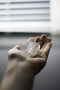 crystal fragment on person's hand thumbnail