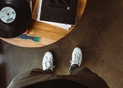 person standing beside table thumbnail