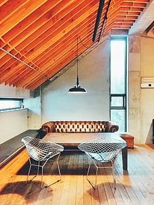 two gray metal chairs beside wooden center table thumbnail