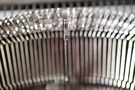 shallow depth of field photo of gray typewriter letter rod thumbnail