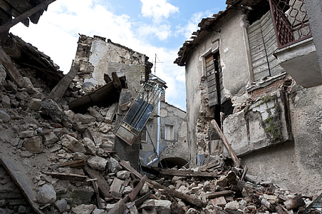 wrecked gray concrete building at daytime thumbnail