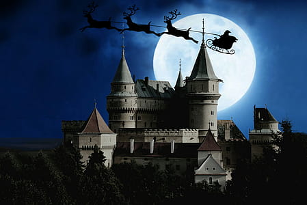 Illustration of Santa and sleigh flying over a castle on Christmas Eve. thumbnail