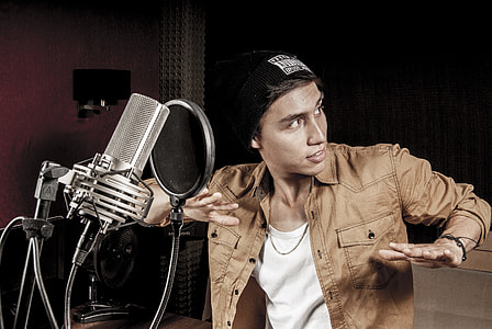 man doing dab step while facing condenser microphone thumbnail