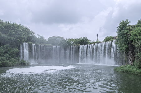 waterfall in the middle of forest thumbnail